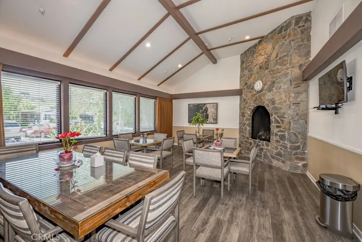 Part of the multipurpose room for dining or visiting friends and family. There is a larger area with a kitchen!