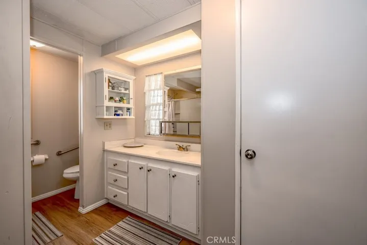 Primary bathroom with a walk-in shower. Grab bars have already been installed.