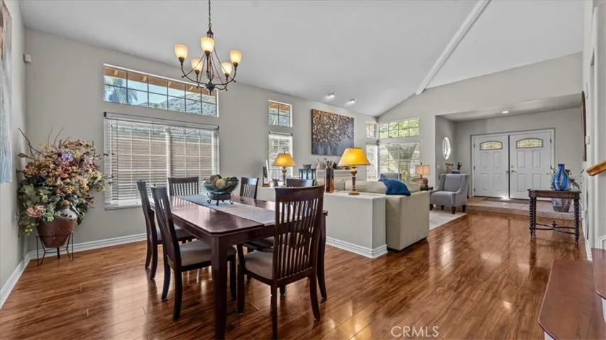 The formal dining area features elegant lighting, large windows, and an open layout, providing a perfect setting for entertaining and special​​‌​​​​‌​​‌‌​​‌​​​‌‌​​​‌​​‌‌​​‌‌​​‌‌​​​​ occasions.