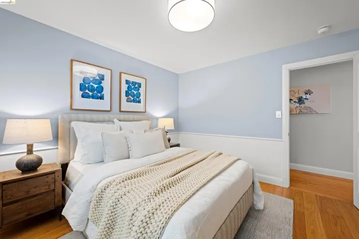 Bedroom with light wood-type flooring and baseboards