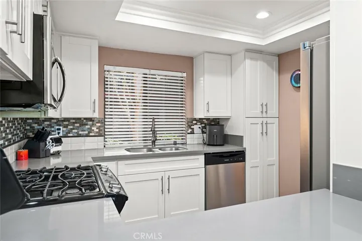 Remodeled kitchen counters, flooring, and cabinets!