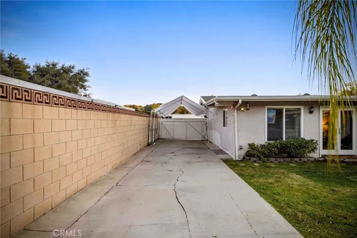 A Vinyl Fence and the long, easy access driveway to park your toys and RV.