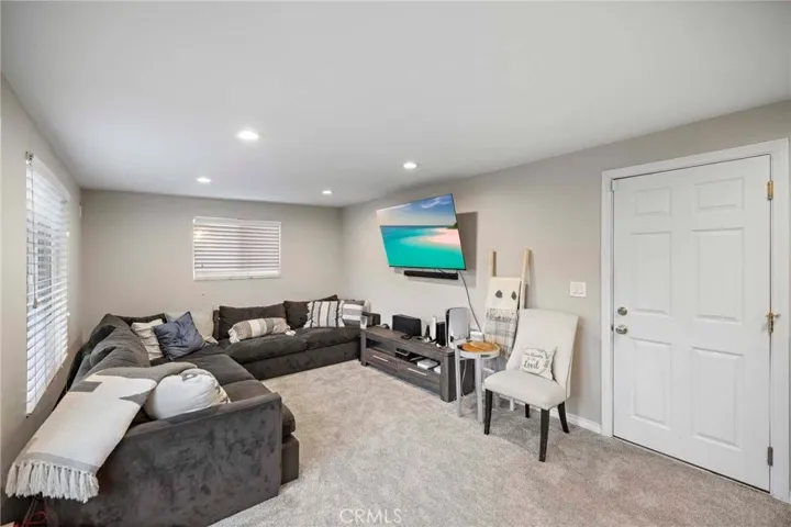 Family room with newer carpet.