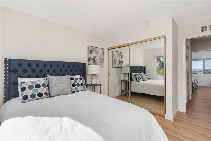 Second bedroom is down the hall from primary. Bathroom and hall closet are in between the two bedrooms.