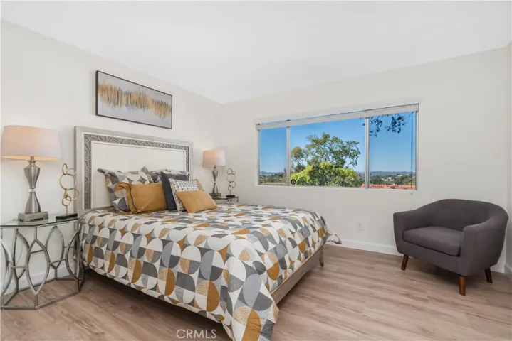 Large primary bedroom with peaceful views