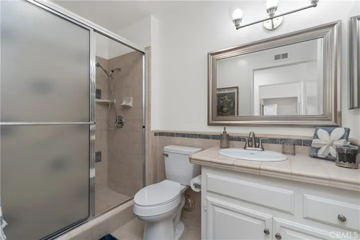 New toilet, shower head, mirror, lighting, medicine cabinet and exhaust fan