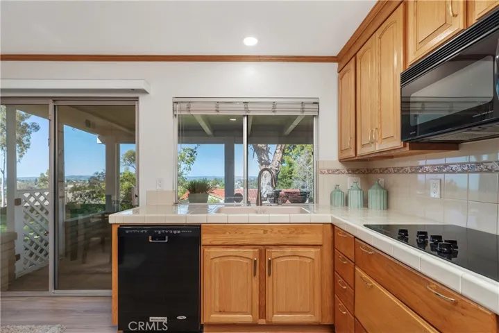 Kitchen leads to back patio with a fabulous view