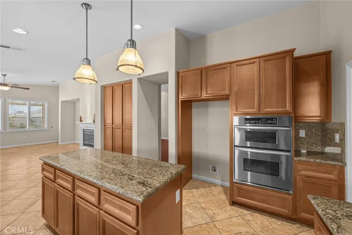 Kitchen with view to family room and fire place
