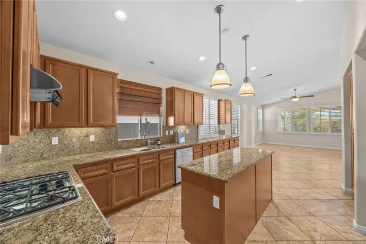 Kitchen looking toward family room with fireplace