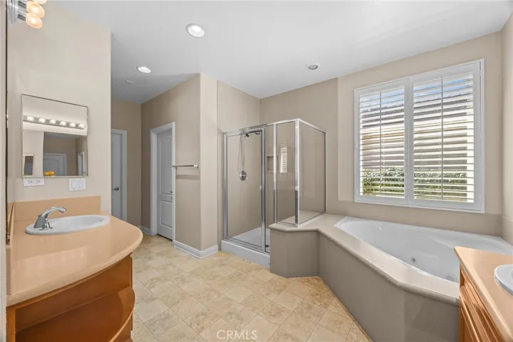 Jetted tub and separate shower in primary bath