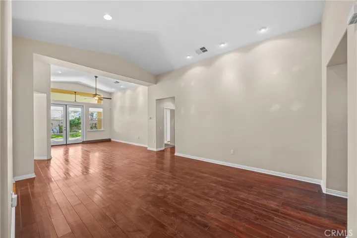 Living room and dining area.   Door to the right back leads to the primary suite