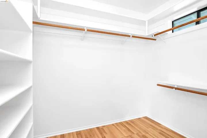 Walk in closet featuring light wood-type flooring