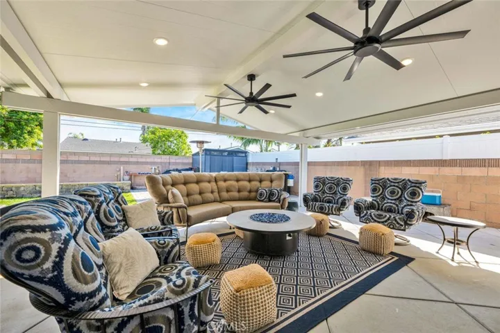 Aluminum Patio cover for outdoor living space with inset lighting ceiling fans and power for speakers