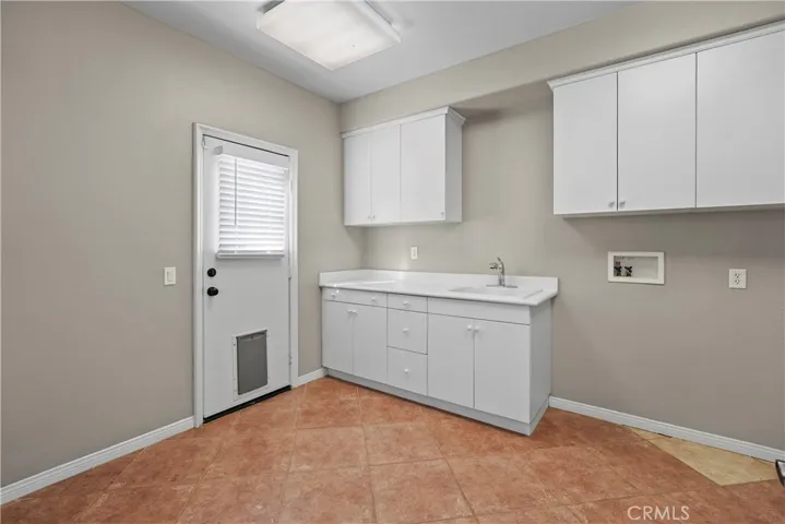 Laundry Room with door to backyard