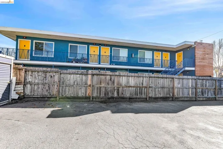 Rear view of property with a balcony