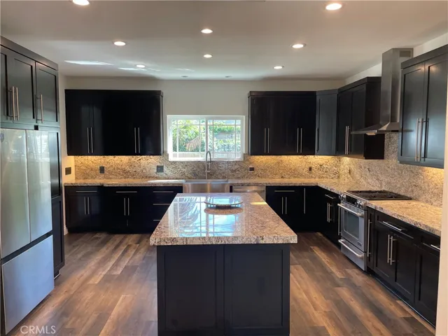 REMODELED KITCHEN WITH MASSIVE ISLAND AND PLENTY OF CABINET SPACE