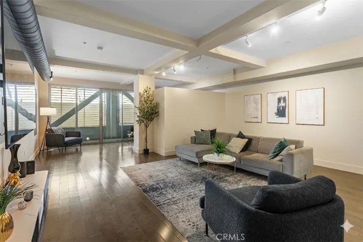 Digitally altered photo showing how you can add a wall to hid the bed area