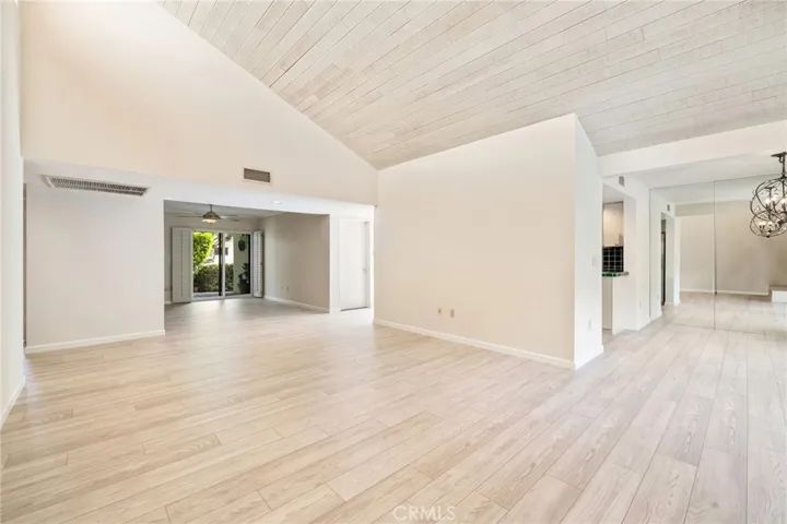L - R; Den, living room and dining area on right.