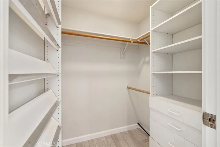 Large walk-in closet in primary suite.