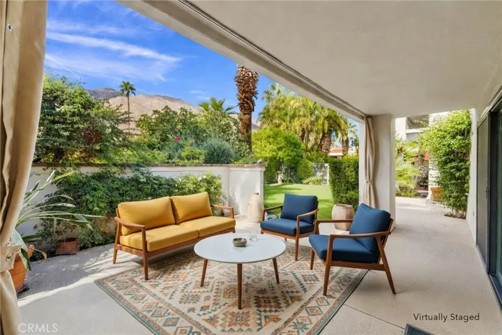 Back patio with view of the San Jacinto mountains, Entrance to pool off to the right. Virtually staged.