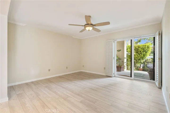 Large den looking out to the front side patio.