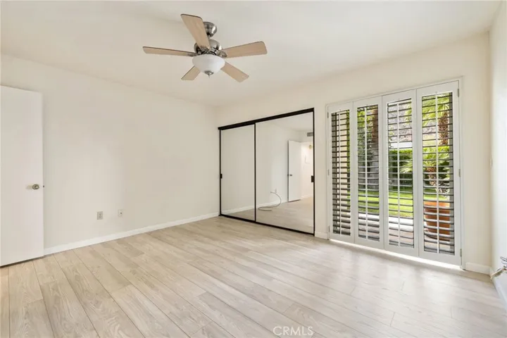 2nd bedroom with view out to the greenbelt.
