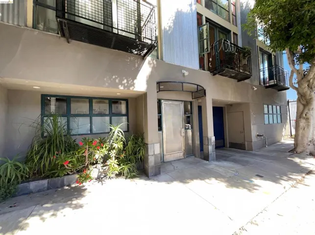 Entrance to property with stucco siding and a garage
