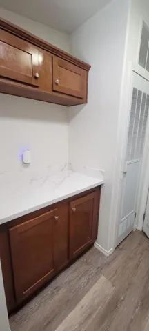 LAUNDRY ROOM CABINETRY AND FOLDING AREA