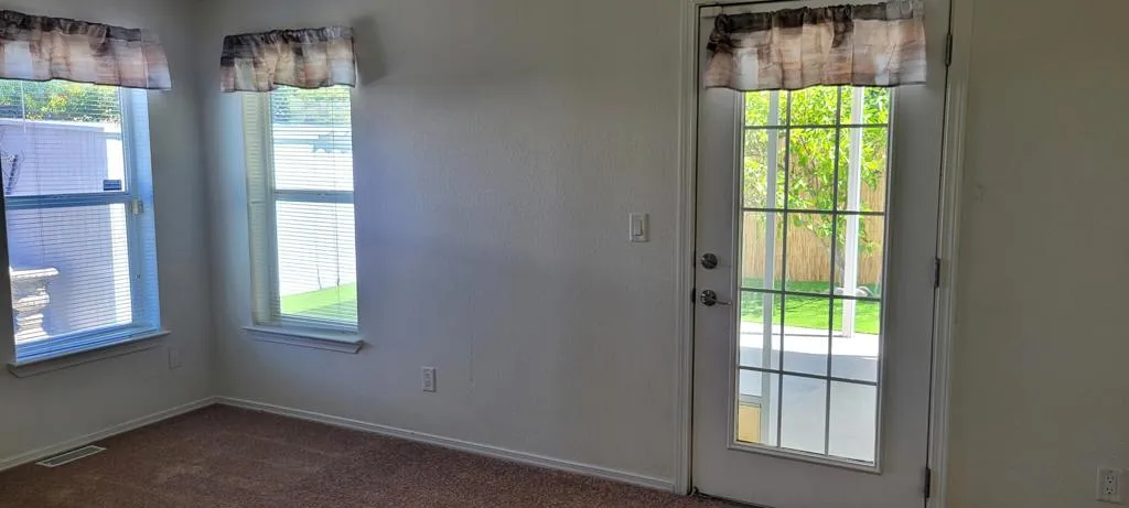 PRIMARY BEDROOM DOOR TO BACKYARD