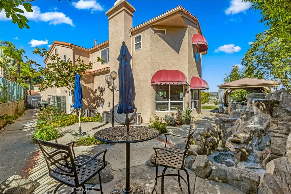 Backyard side area with waterfall feature