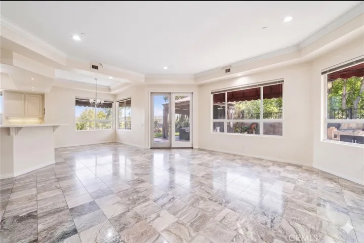 Family room open to 2nd dining area (digitally altered)