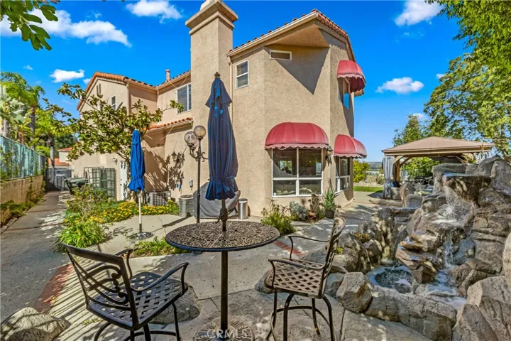 Backyard side area with waterfall feature