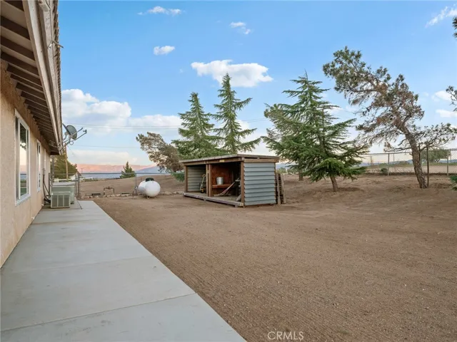 Side of home with shed