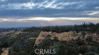 View of sun setting from upper portion of property