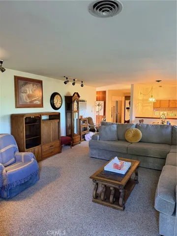 View from living room past entry and into kitchen/dinning area