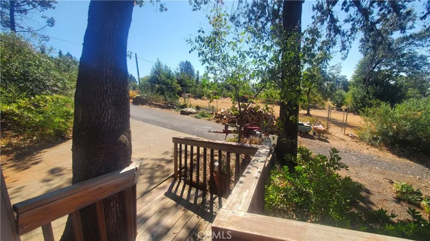 View from deck next to garage looking toward driveway.