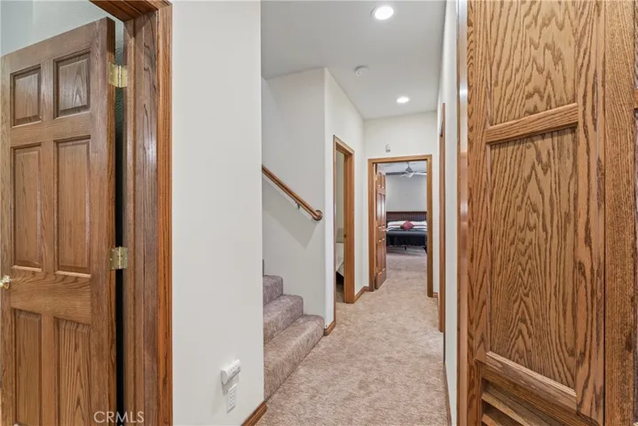 wide hallway and stairs on lower level