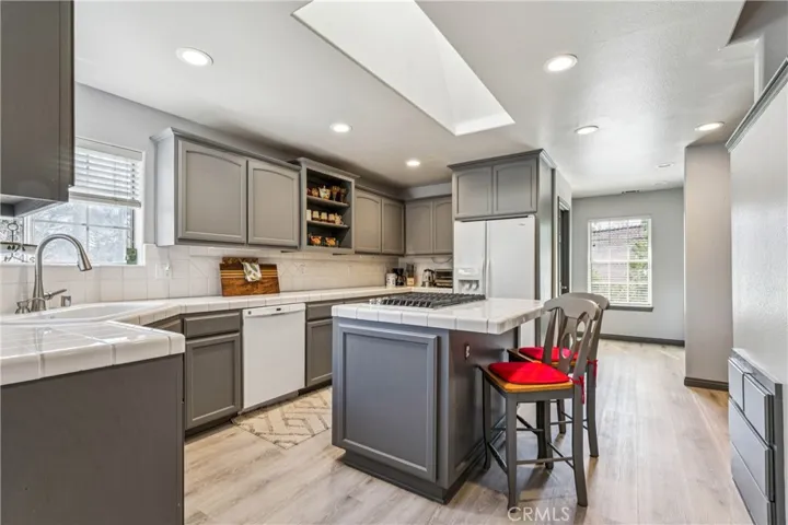 Large kitchen with new ovens & stove - note skylight over the stove
