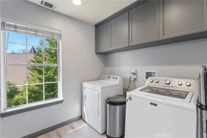 Laundry area adjacent to kitchen and 1/2 bath