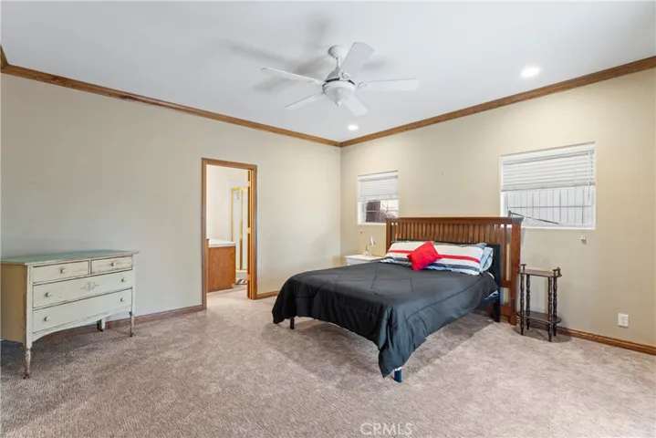 Huge primary bedroom, ensuite, walk in closet, & entry to covered lower deck