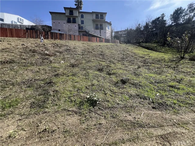 Land begins from the point of where image was taken and ends where the person in the left corner is standing.