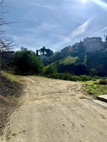 walkway of the unpaved road to the location of the land.