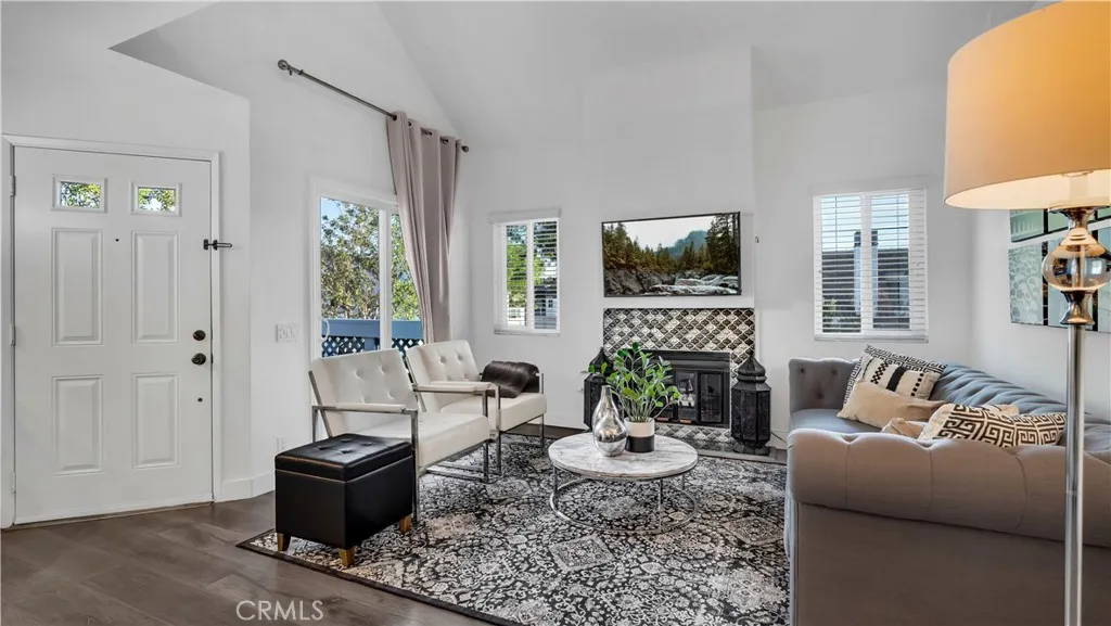 Beautiful vinyl windows and slider plus an upgraded fireplace completes the room.