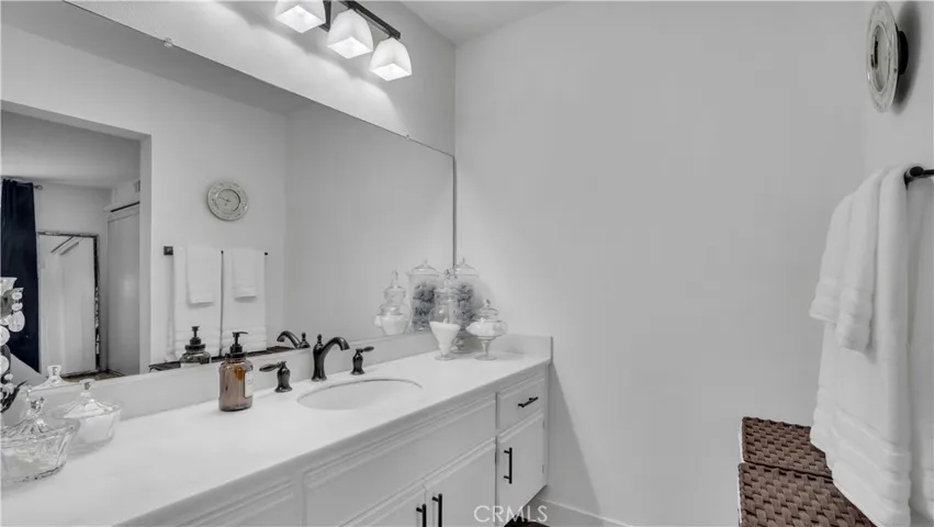 The bathroom has also been updated. Quartz countertops look great in here too.