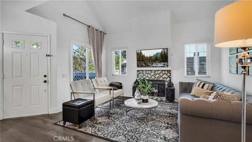Beautiful vinyl windows and slider plus an upgraded fireplace completes the room.