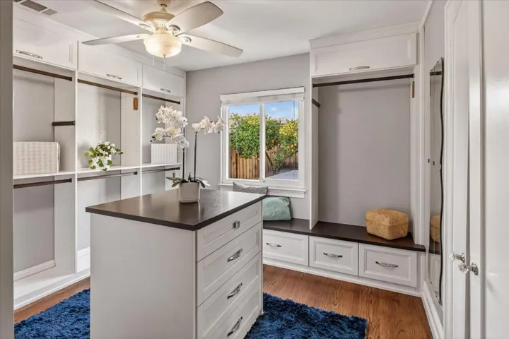 Third bedroom adapted to be a closet. The center dresser is movable.