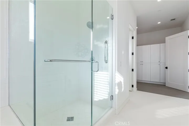 Formal dressing room inside expansive primary bathroom