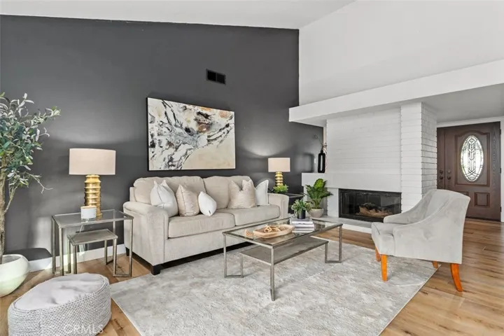 Family room is anchored by a fireplace