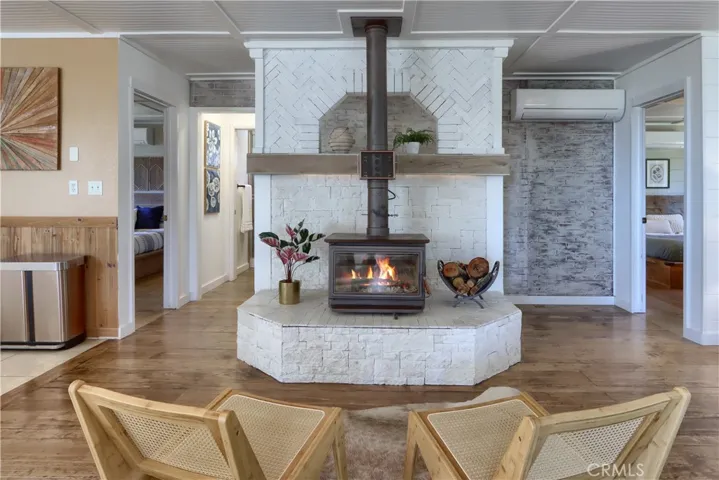 Cozy sitting area with raised white-washed Hearth!
