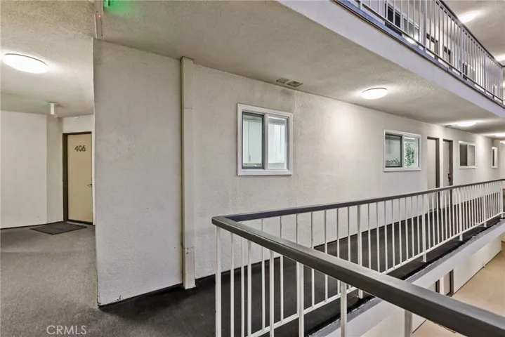 Walkway with Separate Entry Door to Bedroom 2